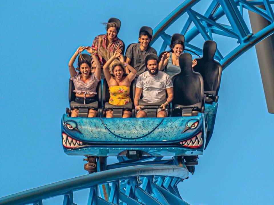 six people ride the Iron Shark coaster at Pleasure Pier in Galveston, Texas