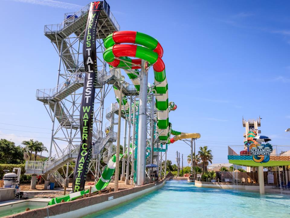 a red and green striped spiral water slide and pool at Schlitterbahn Waterpark in Galveston TX