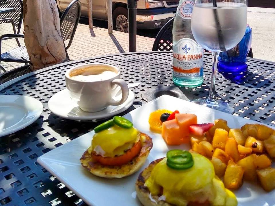 Outdoor patio table with brunch food and coffee at Riondo's Ristorante in Galveston TX