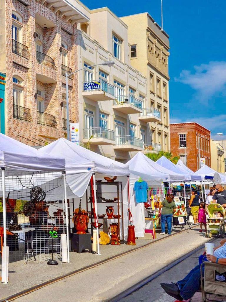 Street view of vendor tents set up at the ArtoberFest event in Galveston Texas