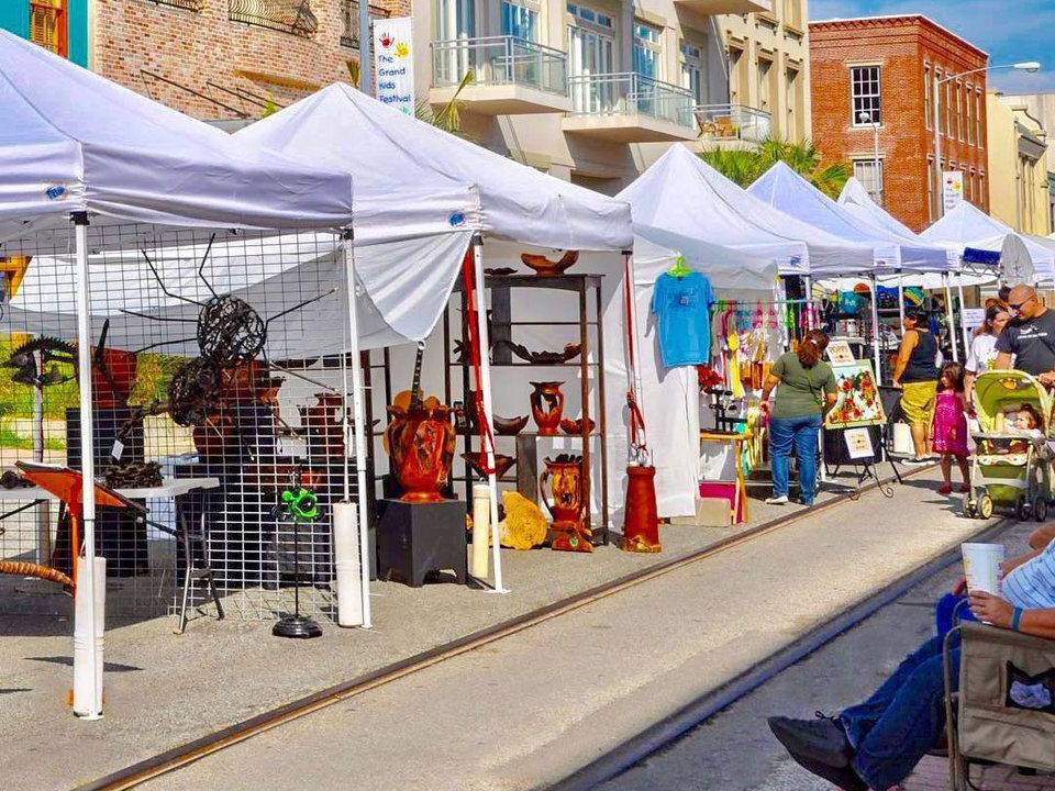Street view of vendor tents set up at the ArtoberFest event in Galveston Texas