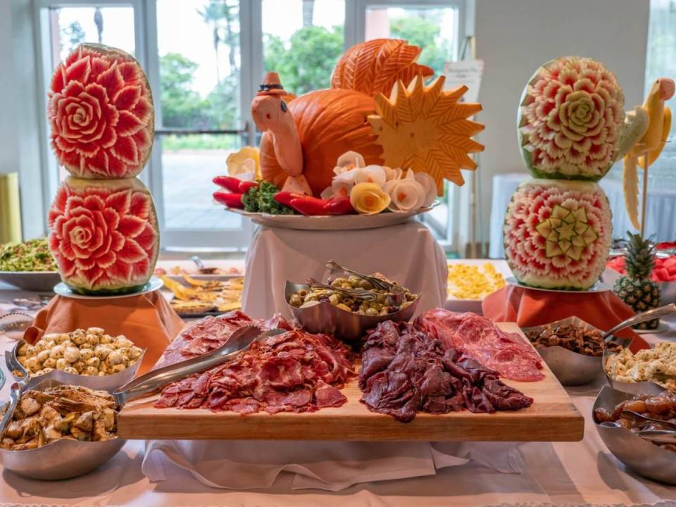 Centerpiece of a turkey made out of a pumpkin surrounded by charcuterie at Thanksgiving Brunch at Moody Gardens