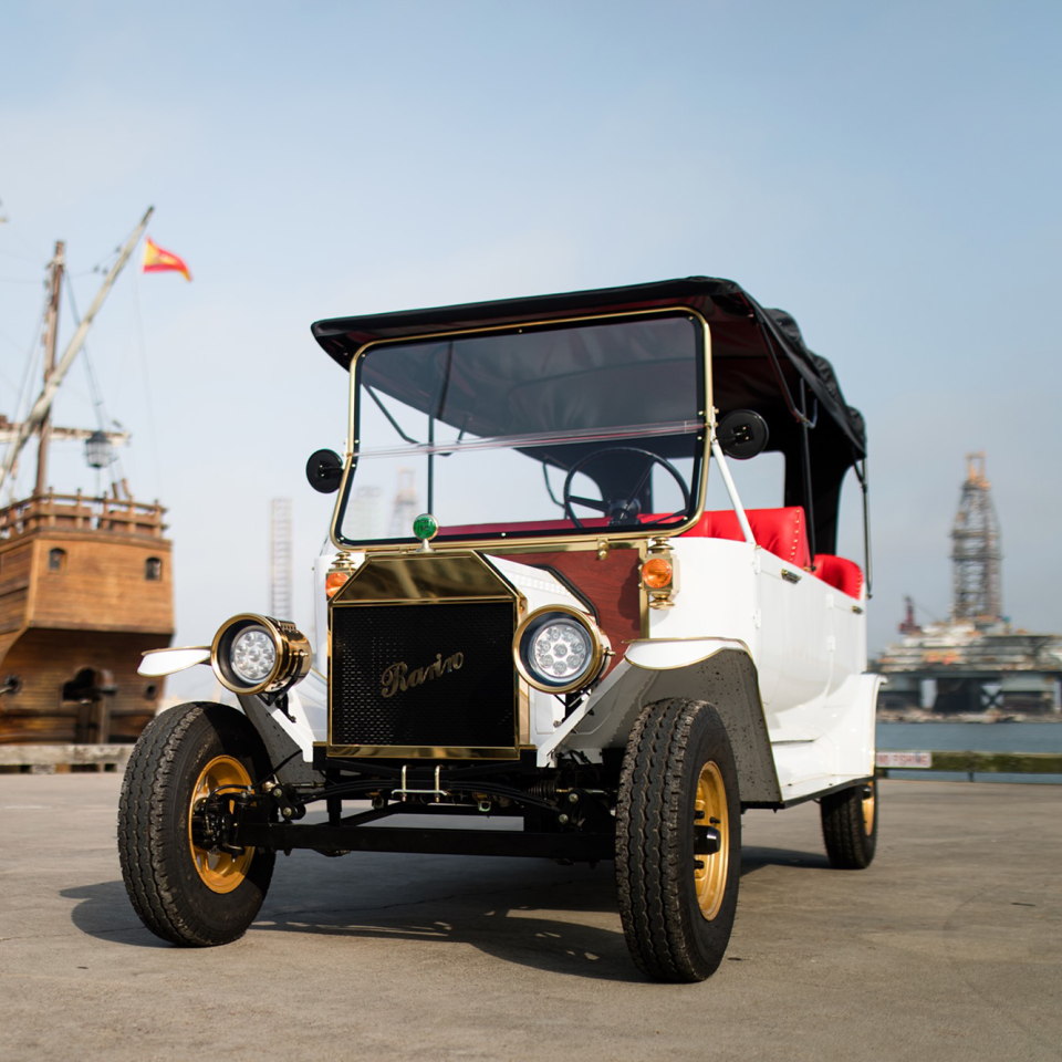 Rental Carriage Haus Model-T Golf Cart Replica Alongside Galveston Coastline on Sunny Summer Day